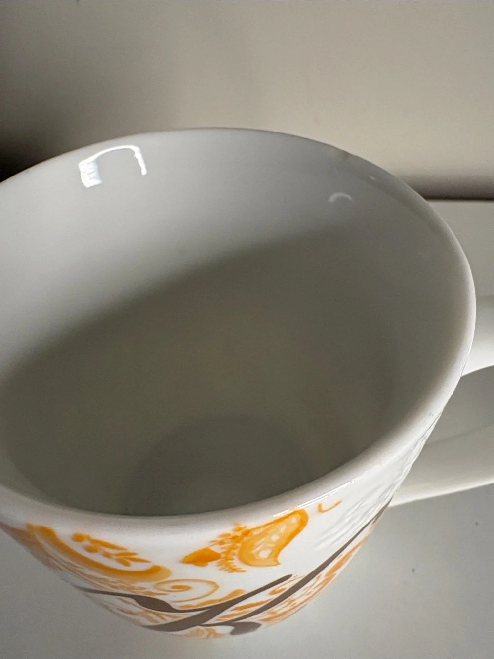 Pier 1 White Mug with Orange and Brown Flourish and 'K' Monogram